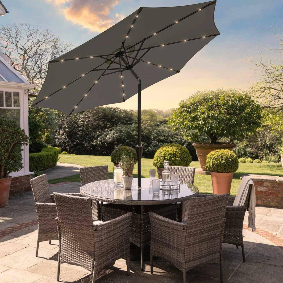 Kemble 6 Seater Rattan Round Dining Set with LED Premium Parasol and Parasol Rain Cover - Grey - Laura James